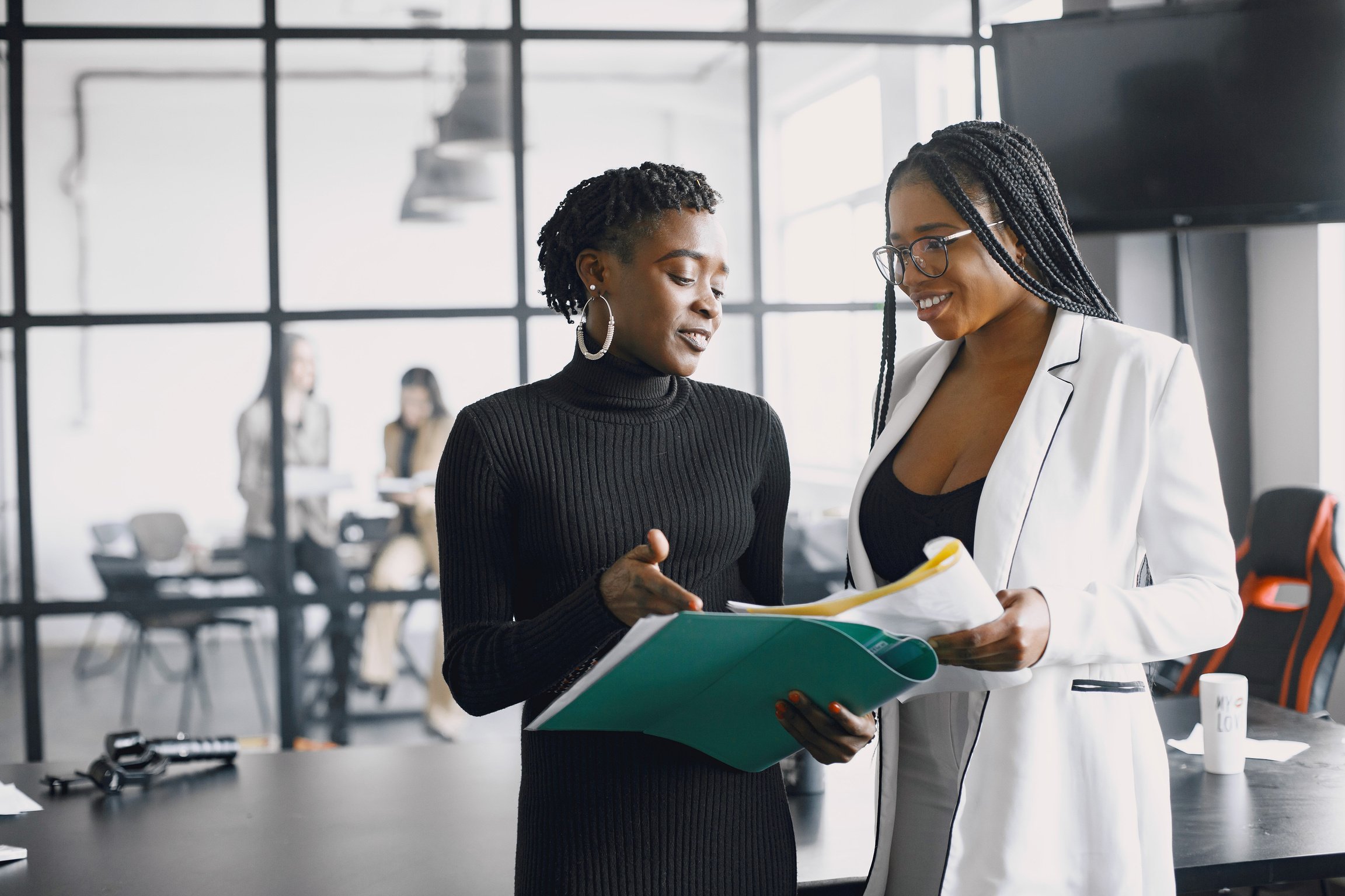 Female Professionals Working Inside Office 